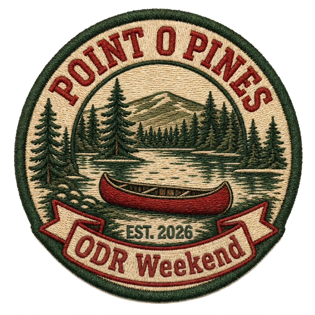 Embroidered camp agus craic camp weekend patch with pines, a lake and a red canoe